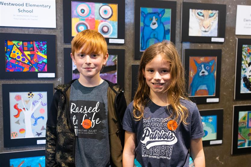 Students and their family at an art show